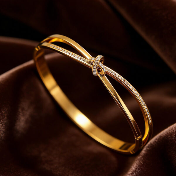 oly-9d7f07eef472172f8c2a09b150644715 Wholesale Stainless steel electroplated gold non-fading jewelry, titanium steel rhinestone knotted bracelet