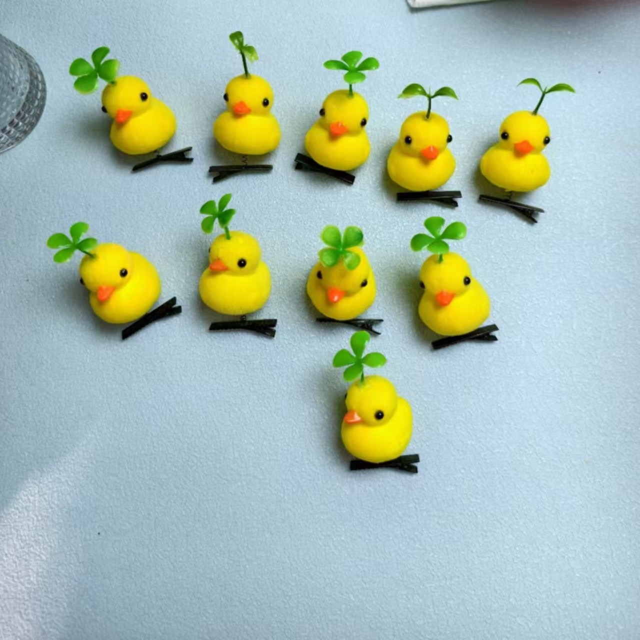 Wholesale Four-leaf clover head long grass hairpin head decorations yellow duck hairpin female Mexico South American foreign trade explosions