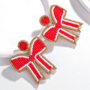 A pair of red bow rice bead earrings