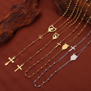 oly-a0732769977c500b09998ad39c4cffa2 Wholesale British Style Retro Niche Personality Jewelry Embossed Figure Round Brand Tassel Cross Pendant Titanium Steel Gold Plated Necklace