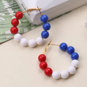 red, white and blue ear ring