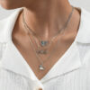 oly-a1bc5b7af4ffe93d3af4968f092719ce Wholesale 3 fashionable exquisite metal love book three-dimensional heart pendant literary temperament ladies necklace suit