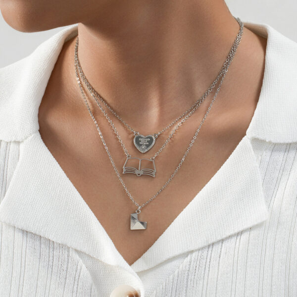oly-a1bc5b7af4ffe93d3af4968f092719ce Wholesale 3 fashionable exquisite metal love book three-dimensional heart pendant literary temperament ladies necklace suit
