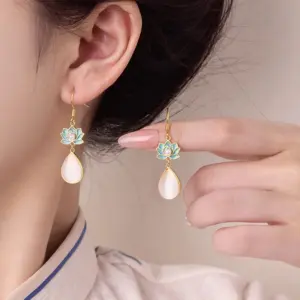 Wholesale Lotus Earrings For Women In Golden Plated Copper Featuring Freshwater Pearl Inlay