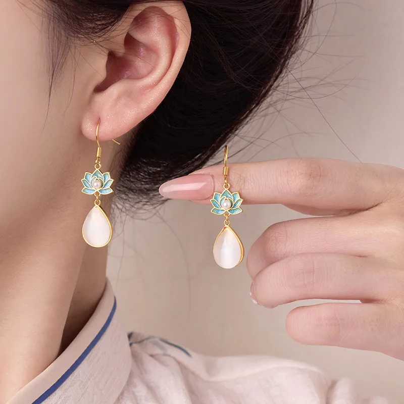 Wholesale Lotus Earrings For Women In Golden Plated Copper Featuring Freshwater Pearl Inlay