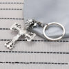 oly-a33a21889a1825dc96f70d9129207bec Wholesale Crow flame cross keychain niche punk retro do pendant car pendant