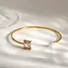 Wholesale Asymmetrical Round Bangle For Women In 304 Stainless Steel With 18K Gold Plated And PVD Coated Finish, Artificial Pearl Inlay