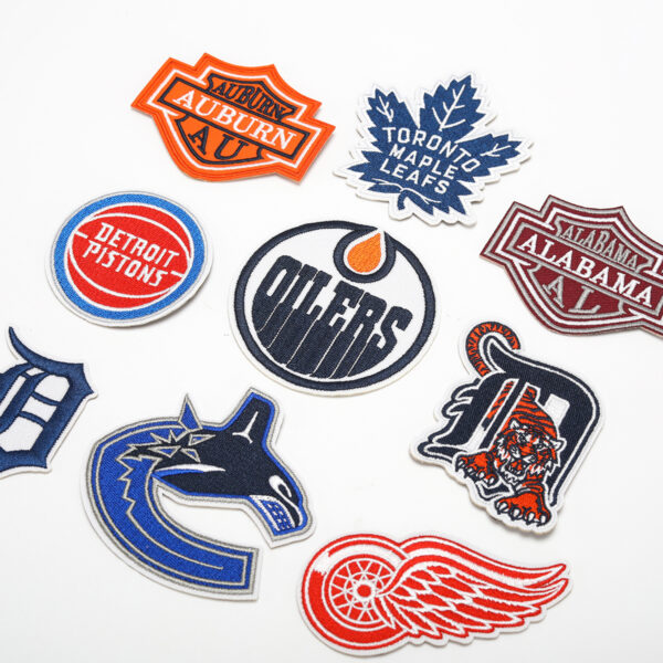oly-a53e8fd17b4f3fd24958424de0c1eb4e Wholesale embroidered basketball team computer embroidered stickers clothing bag decorative stickers shoes and hats patch maple leaf letter stickers