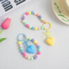 oly-a618b451a34d36fac439ddfba1f75fd2 Wholesale Fresh Style Bow Love Bead Pendant ins Colorful Beaded Wrist Chain Car Keychain Accessories Women