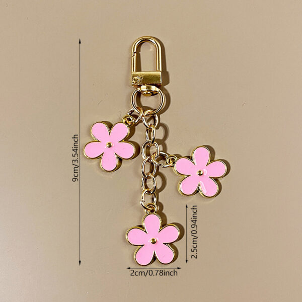oly-a6deb75dae0c103169541f9f6574be7e Wholesale double-sided drip oil color flower alloy keychain creative Airpods bag pendant