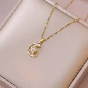 X2038 Star and Moon Rotating Necklace
