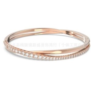 Twisted intertwined rose gold and white diamond bracelet