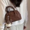 oly-aad33d32059a2ccadedd07d7e30a73e1 Wholesale Korean niche brown bowling ball handbag for women, autumn/winter style, high-end retro crossbody bag.