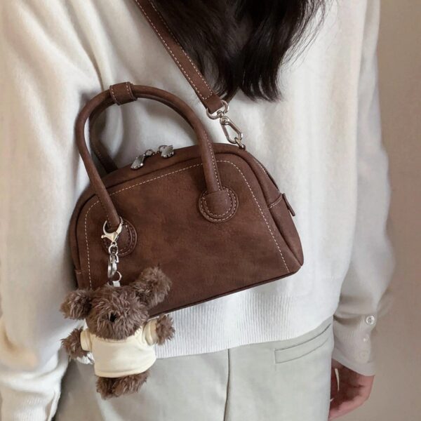 oly-aad33d32059a2ccadedd07d7e30a73e1 Wholesale Korean niche brown bowling ball handbag for women, autumn/winter style, high-end retro crossbody bag.