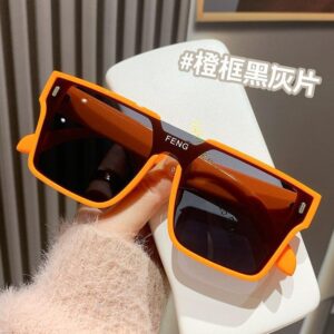 Plastic teeth / Orange frame with black and gray accents