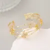 Wholesale Snake Pattern Bangle In Copper With 14K Real Gold Electroplated Finish Featuring Zircon Inlay In Gold