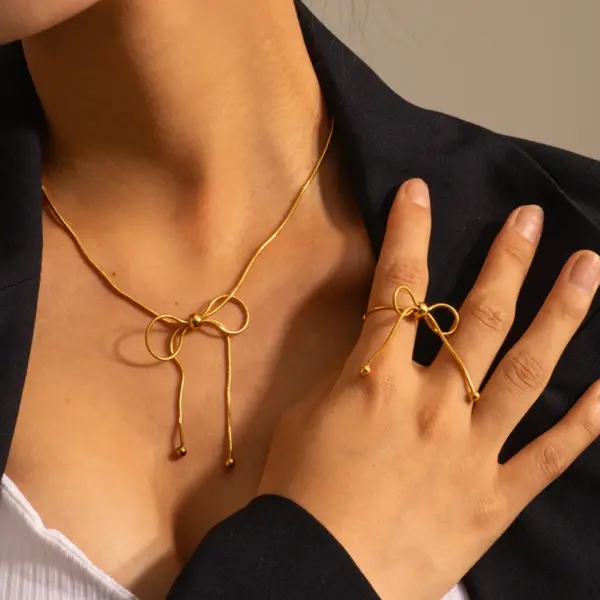 oly-b3131f6d3f2c0747e0967a1519e4407c Wholesale PVD Coated Real Gold Plated 18K Gold Bow Knot 304 Stainless Steel Simple Style Waterproof Non Tarnish 304 Stainless Steel Pendant Necklace