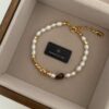 oly-b34794bb354a5ca27f869a589b9f66bc Wholesale Denise Small Fresh High-end Sense Design Rice Pearl Tiger Eye Stone Adjustable Bracelet Niche Elegant Fashion Women