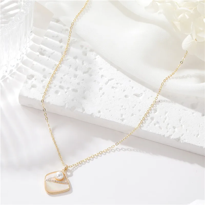 Wholesale Asymmetrical Shell Necklace For Women Featuring Copper Pendant With Electroplated Gold Plating