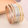 Wholesale PVD Coated 18K Gold Plated Round Stainless Steel Simple Style Waterproof Non Tarnish 304 Stainless Steel Bangle