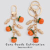 oly-b93830c1f0da68038edf53b8eb9c4d4b Wholesale Persimmon Keychain Good Things Happen Persimmon Ruyi Sansheng III Bag Exquisite Hanging Accessories Mobile Phone Rope Earphone Box