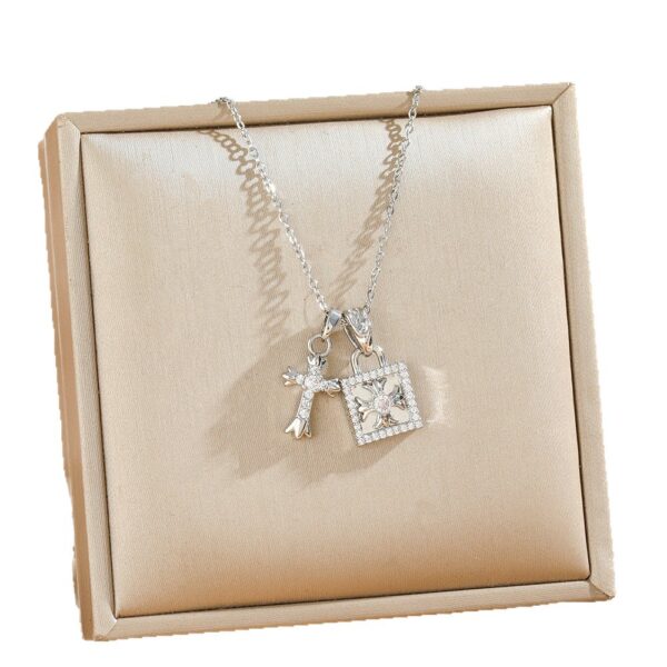 Wholesale Cross-shaped titanium steel necklace with square clasp, exuding a luxurious and versatile vibe, perfect for clavicle chain.