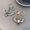 oly-bb86b24d32ca5c469ce33ce98abd15e5 Wholesale creative Opal eagle wing retro key chain car key chain accessories decoration key pendant