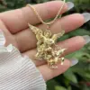Wholesale Waterproof Non Tarnish Skull Pendant Necklace For Women In 18K Gold Plated Copper With Zircon Inlay And Snake Chain