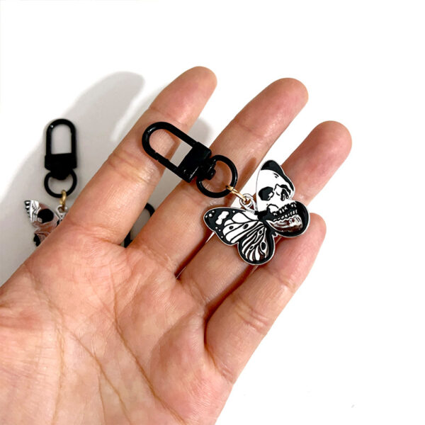 oly-be2314d8bb6a9ed8a40d1fbd7c748b68 Wholesale game series trendy skull butterfly keychain Halloween vintage pendant cold style all-match OLY Exclusive