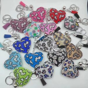 oly-bf927d1458a72672b5f8a31cb755aa84 Wholesale Creative personality leopard print peach heart drilling tassel key chain bag pendant diamond flannel gift accessories