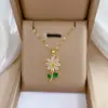 Wholesale 201 Stainless Steel Copper Flower Water Plating Vacuum Plating Zircon 18K Gold Plated 18K Gold Simple Style Coffee Bean Chain Transparent Gold Pendant Necklace