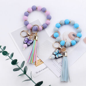 oly-c1d75ba54008ad076bc2e214b7363058 Wholesale Creative DIY Beaded Cartoon Butterfly Wrist Keychain Pendant Rainbow Leather PU Tassel Ring Key Ring Accessories