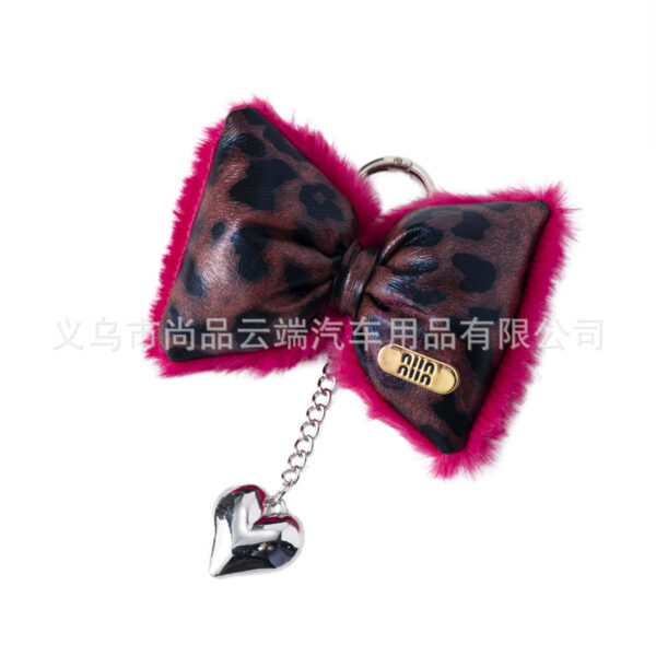 oly-c3b64e5c7835aa6b0b8b27ec79098f94 Wholesale Ins Accessible Luxury Leopard Print Leather Cotton-Filled Bow Heart Keychain Niche Design Sexy Sweet and Cool Mobile Phone Chain