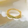 Wholesale Women’s Crossover Rings With Zircon Inlay, Copper Base Featuring KC Golden Water Plated Bezel Setting