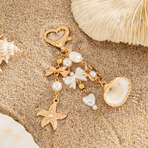 oly-c448b08e5c5084dfcbb9f2b89f48cf6f Wholesale Marine Vacation Dolphin Fan Shell Turtle Keychain Irregular Crystal Pendant Bag Hanging Ornaments