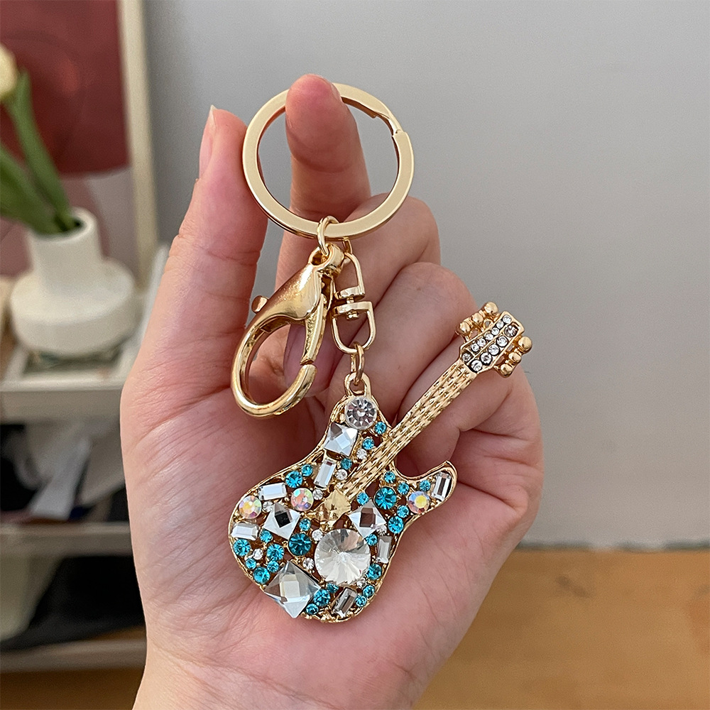 Wholesale European and American creative fashion diamond-encrusted guitar car keychain metal musical instrument model bag key chain pendant