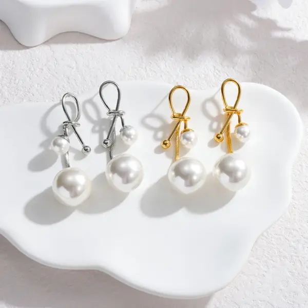 Wholesale French Retro Fashion Versatile Pearl Tassel Knotted Earrings Elegant Light Luxury Stainless Steel Earrings For Women Factory Direct Sale