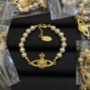 oly-c4f91178e7b3f19713df5af0e9e5a681 Wholesale Empress Dowager Saturn Bracelet High Version Classic Saturn Diamond Pearl Bracelet Light Luxury All-match Pearl Bracelet