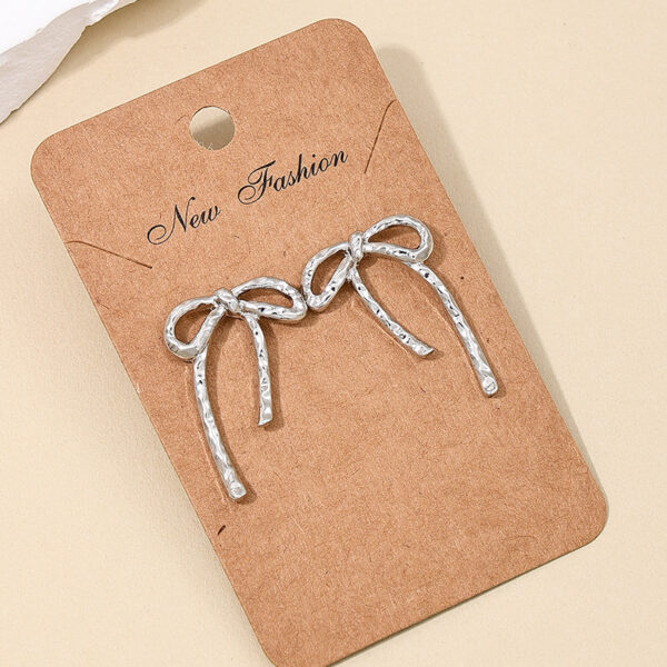 Wholesale 1 Pair Ig Metal Style Simple Spring and Summer Earrings Hollow Bow Women Commuter Earrings Earrings Stud