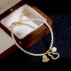 Wholesale Fashionable Luxury Pearl Bracelet Original Design Round Xiaomi Pearls Gourd Pendant Lucky Charm Safe Keeping Women's Bracelet