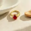 Wholesale Geometric Open Ring For Women In Brass With Golden Plated Water Plating And Claw Setting Featuring Artificial Gemstones