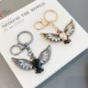 oly-cecc4836bceae42955c18348e9724634 Wholesale creative Opal eagle wing retro key chain car key chain accessories decoration key pendant