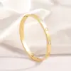 Wholesale PVD Coated Real Gold Plated 18K Gold Cross Heart Shape Flower 304 Stainless Steel Elegant Waterproof Non Tarnish 304 Stainless Steel Bangle