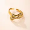 Wholesale Irregular Unisex Titanium Steel Ring For Everyday Wear Featuring Electroplated Gold Plating And Rhinestone Inlay
