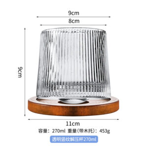 Transparent vertical pattern rotating whiskey glass with wooden holder