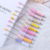 oly-d0171ea98dab1a05ca2e539b30e20d6e Wholesale DIY sequins beaded pen wholesale five-pointed star sequins creative cute beaded ballpoint pen stickers diamond cute pen