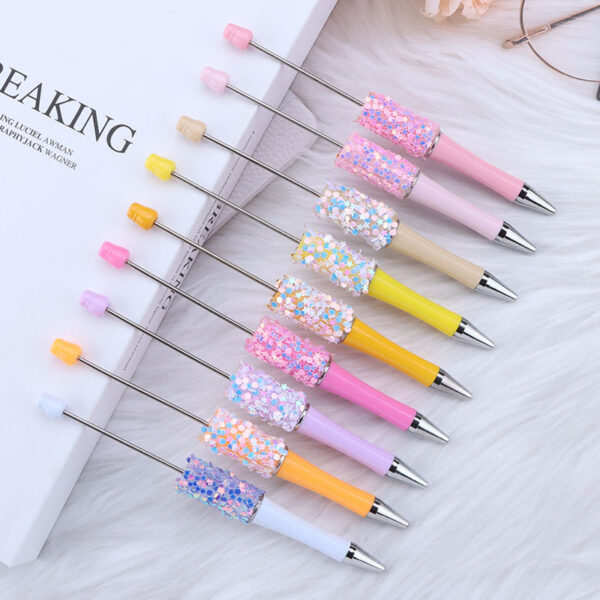 oly-d0171ea98dab1a05ca2e539b30e20d6e Wholesale DIY sequins beaded pen wholesale five-pointed star sequins creative cute beaded ballpoint pen stickers diamond cute pen