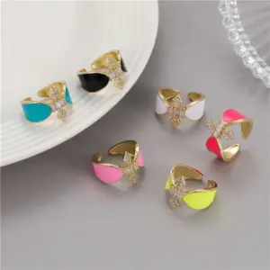 Wholesale Women’s Bow Tie Open Rings Featuring Enamel Craft And Zircon Inlay, Electroplated Copper Material