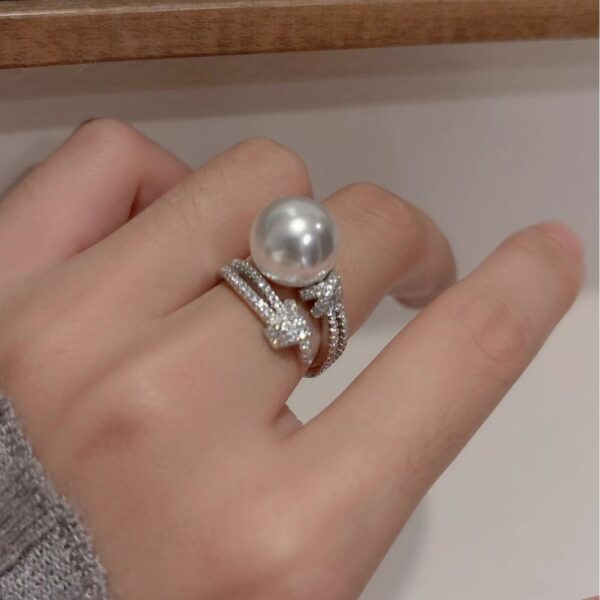 oly-d26bc4316db2db440fe0af11c21fbe2c Wholesale S925 Silver Heavy Industry Full Diamond Winding Australian White Single Pearl Ring Women's Noble High-end Light Luxury Open Ring