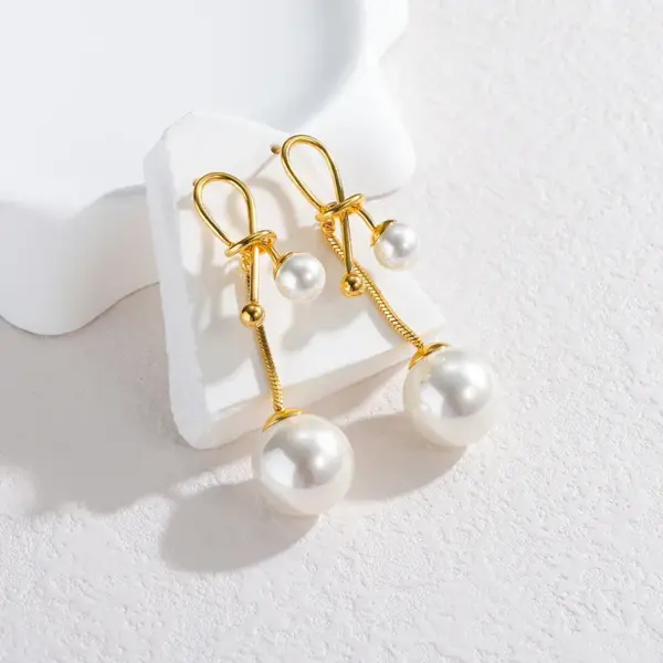Wholesale French Retro Fashion Versatile Pearl Tassel Knotted Earrings Elegant Light Luxury Stainless Steel Earrings For Women Factory Direct Sale